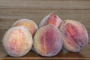 Peaches on a wooden table