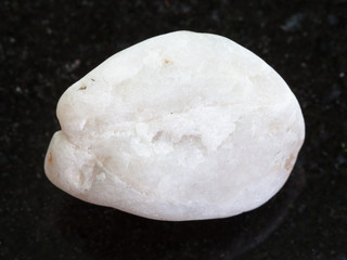 white marble stone on dark granite background