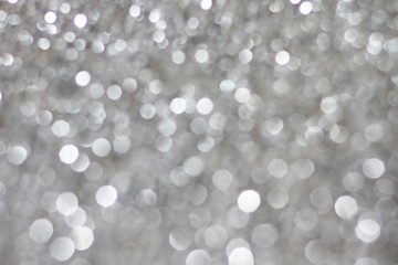 Glitter silver white bokeh abstract background