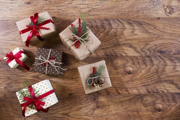 christmas gifts on wooden table from above