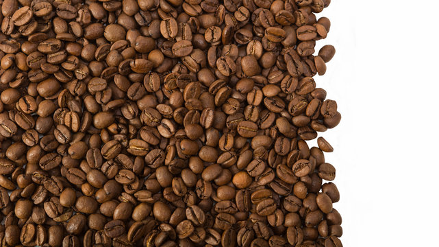 Roasted coffee beans   over white background with space  for text or image