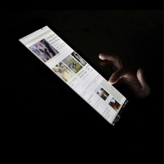 woman checking news at her pad