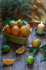New Year's fruits in the basket. Oranges and tangerines for the festive table.