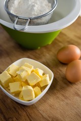 Flour in strainer with eggs and cheese