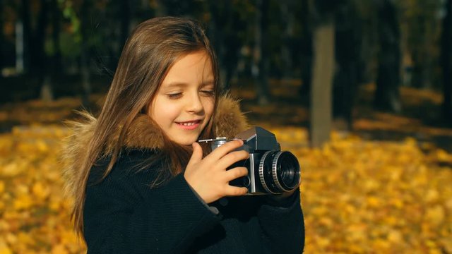 Little girl with camera