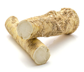 Fresh horseradish root isolated on white background two halves