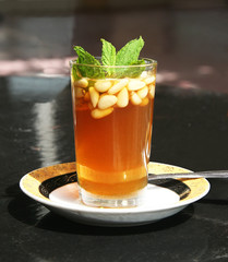Tea with mint and pine nuts