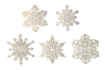 Silver snowflakes ornaments isolated on white background. Set of five different silver snowflakes.
