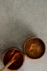 Cinnamon powder and red chili powder in bowl