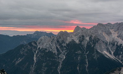 Fototapeta na wymiar Spectacular sunrise line behind a mountain ridge.