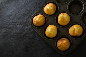 Plain cupcakes on baking tray