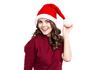 Emotional girl in santa hat isolated on white background.