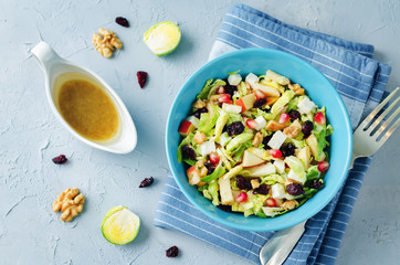 Shredded brussel sprout apple dried cranberry walnuts salad