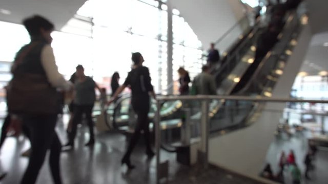 blurred people in a modern corridor