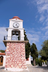 Fototapeta na wymiar Greek clock tower in Skiathos