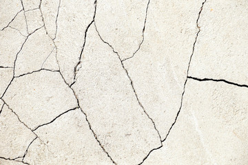 Crack. Texture of old painted white plaster. Cracked wall.