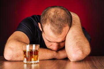 Drunk Man Sleeping At Bar Counter