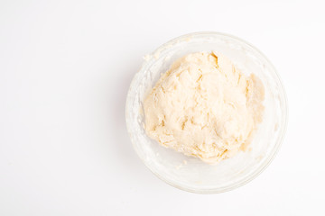 dough for baking cookies on a white table