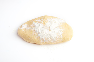 dough for baking cookies on a white table