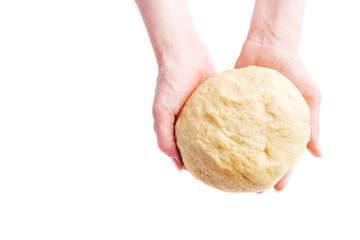 Making dough by female hands on white table