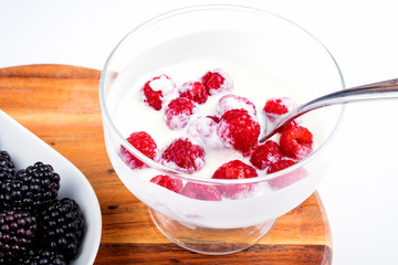 Healthy Greek yogurt bowl with fresh berry, on a white background