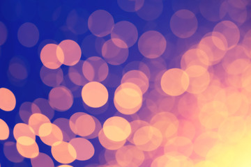 Abstract xmas Gold sparkles or glitter lights. Christmas festive gold background. Defocused bokeh  particles. Template for design