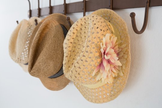 Close-up pf hats hanging on hook