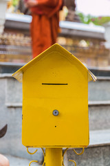 donation box at temple in thailand