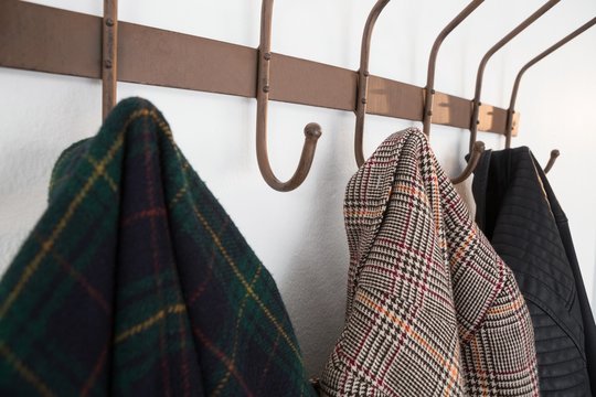 Close-up of warm clothes hanging on hook