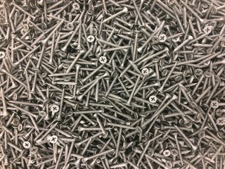Pile of black metal screws