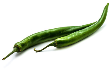 Two whole Chili peppers, green Cayenne, isolated on white background