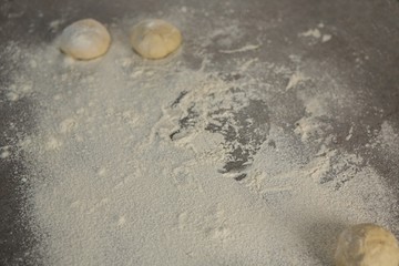Fototapeta na wymiar Dough balls and flour
