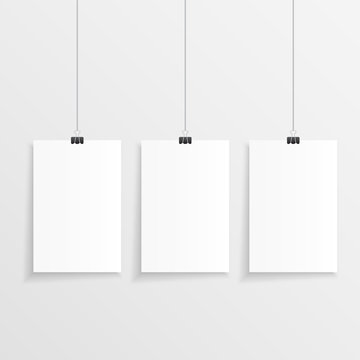 Realistic hanging paper set with three step and clips. Vector illustration of three blank papers with space for text in front of a wall.