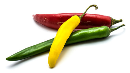 Red, green and yellow Cayenne Chili peppers isolated on white background whole