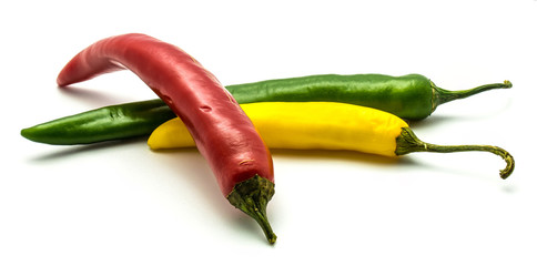 Red, green and yellow Cayenne Chili peppers isolated on white background whole