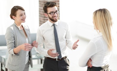 Manager and business team talking in the office.