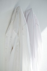 Fototapeta premium Shirts hanging on wall