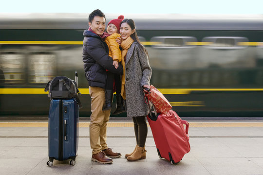 Happy family at the station platform