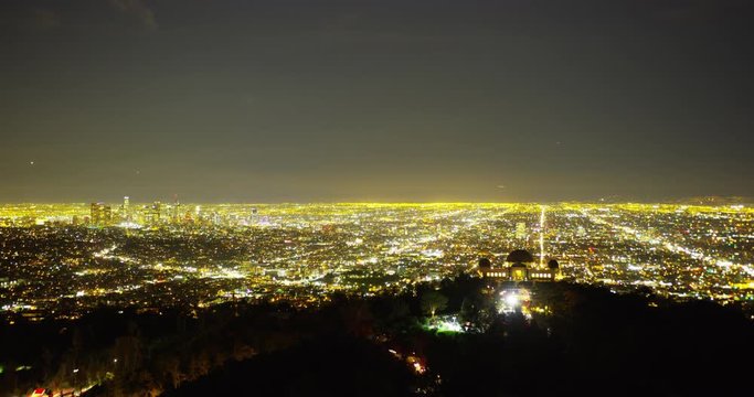 Wide shot timelapse of The Griffith Observatory and DTLA skyline in Los Angeles, California.