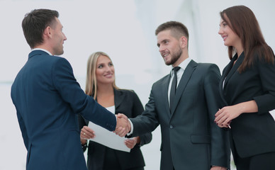 Business partner greeting each other with handshake