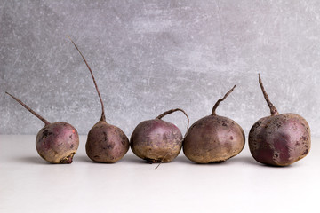 Organic Red Beetroots on a stone background. Horizontally view.