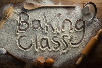 The word baking class written on sprinkled flour - Powered by Adobe
