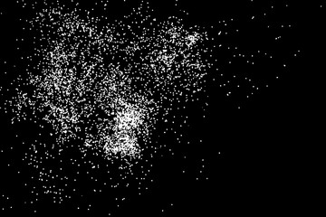 Abstract grainy texture isolated on black background. Top view. Dust, sand blow or bread crumbs. Silhouette of food flakes such as salt or almond or wheat flour spread on the flat surface or table.