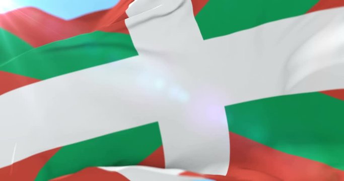 Basque country flag named Ikurri&ntilde;a moving slowly by the wind with blue sky, loop