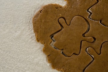 Flattened dough cut with a cookie cutter