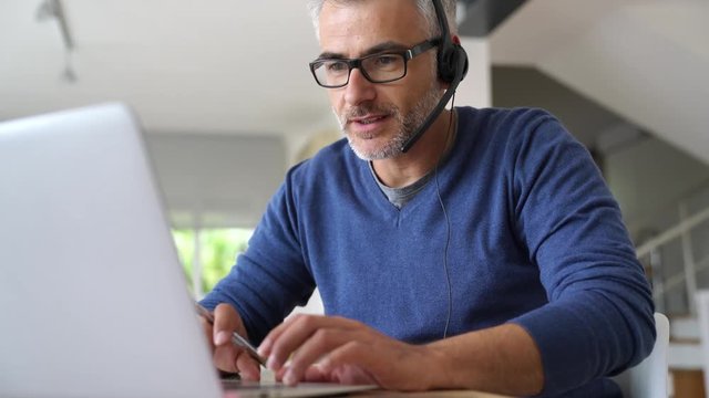 Sales representative teleworking from home-office