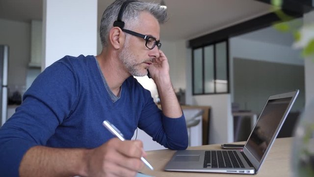 Sales representative teleworking from home-office