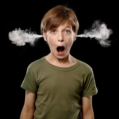 School Boy being over worked and shocked with all the homework he gets: Steam comes out of his Ears, Isolated on Black Background