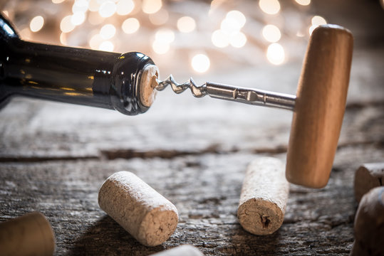 Celebrating New Year or Chreistmas opening bottle of wine