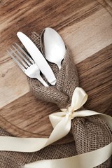 Decorative Cutlery Set on the Wooden Cutting Board